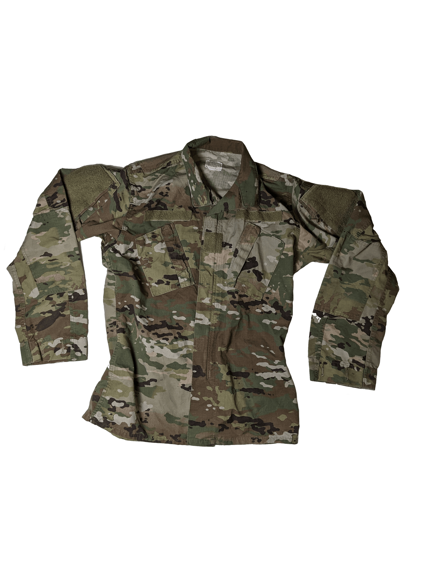 The Multicam (OCP) Shirt by Six Gun Surplus is a camouflage military jacket made from durable fabric. It features a digital camouflage pattern with various shades of green, brown, and beige. The long sleeves have padded patches, and there are multiple pockets on the front, closely resembling a classic Multicam BDU Shirt against a black background.