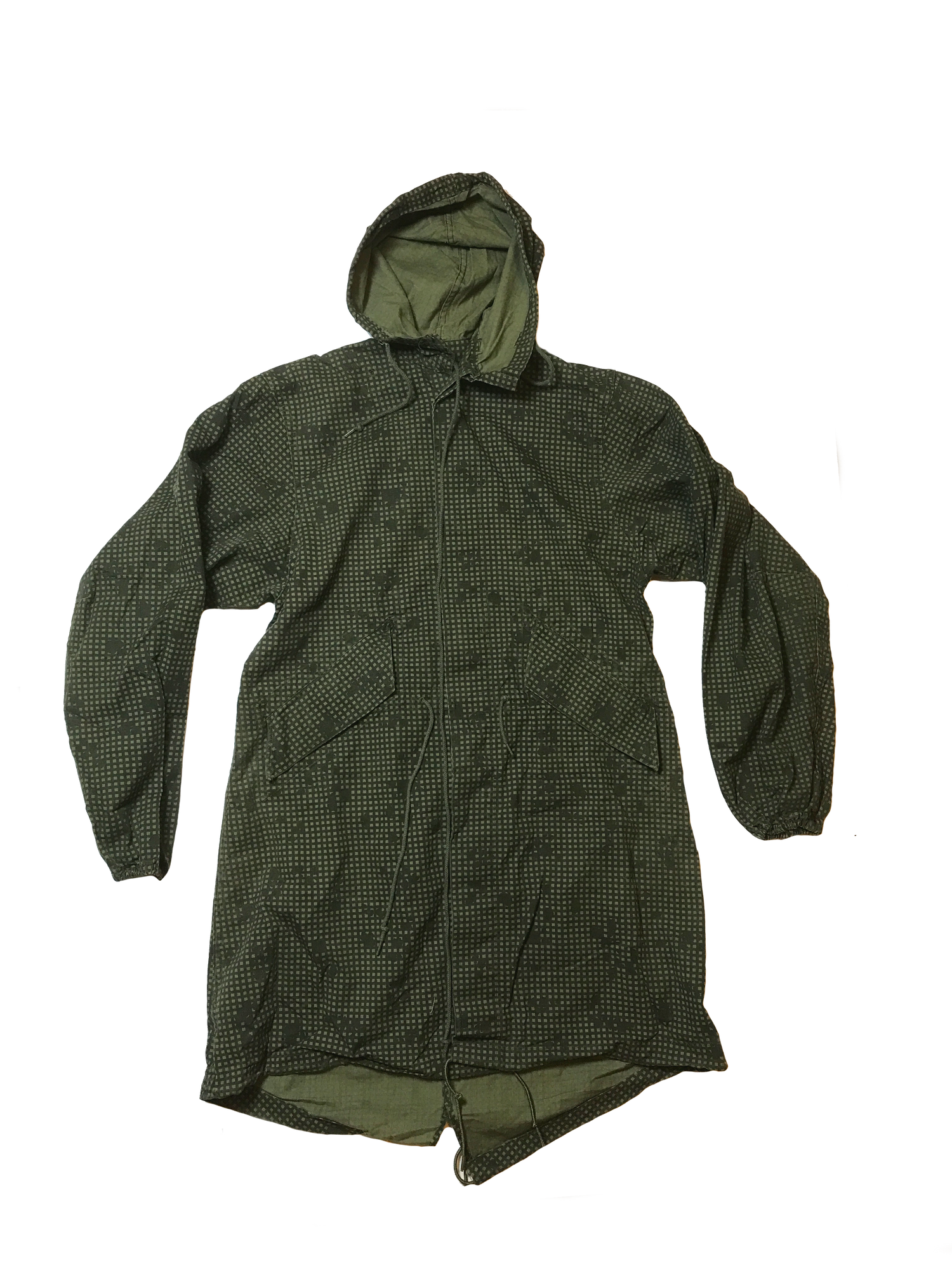 A green hooded raincoat with a subtle dotted pattern, reminiscent of Six Gun Surplus Desert Night Camo Parka style. The coat features a front zipper, two large pockets, and adjustable drawstrings at the waist and hood. The material appears lightweight and water-resistant, echoing USGI Surplus quality.