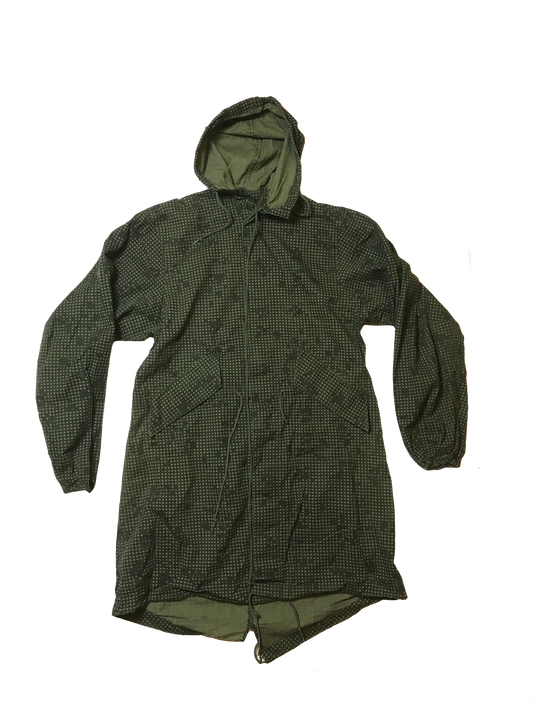 A green hooded raincoat with a subtle dotted pattern, reminiscent of Six Gun Surplus Desert Night Camo Parka style. The coat features a front zipper, two large pockets, and adjustable drawstrings at the waist and hood. The material appears lightweight and water-resistant, echoing USGI Surplus quality.