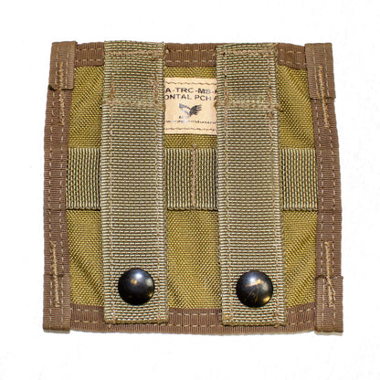 A square military-style utility pouch with olive drab and tan fabric. It features two vertical webbing straps with black snap buttons and a small label at the top. This versatile addition appears to be designed for attaching to MOLLE gear systems, offering a customized storage solution called the MOLLE Horizontal Adapter from Six Gun Surplus.