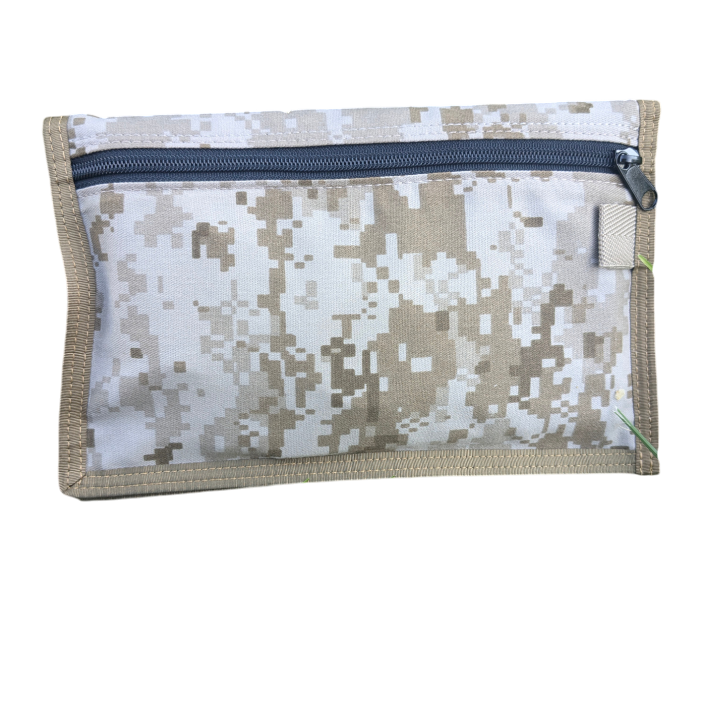 Introducing the Six Gun Surplus Map Case "RECCE pouch": a compact, rectangular map pouch showcasing a digital camouflage pattern in beige and white shades. This durable pouch features a single blue zipper along the top edge, reinforced with sturdy beige stitching. The zipper pull comes attached to a green thread loop, making it ideal for securely storing your land navigation gear.