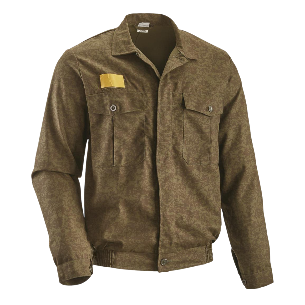 Introducing the Czech Dark Leaf Camo Field Shirt by Six Gun Surplus: A brown camo-patterned long-sleeve shirt with two front pockets and a yellow rectangular patch on the right shoulder. Designed with button closures, it's made from a durable 50/50 polyester/cotton blend and features reinforced elbows for added durability, a collar, and an elastic waistband at the bottom. The background is black.