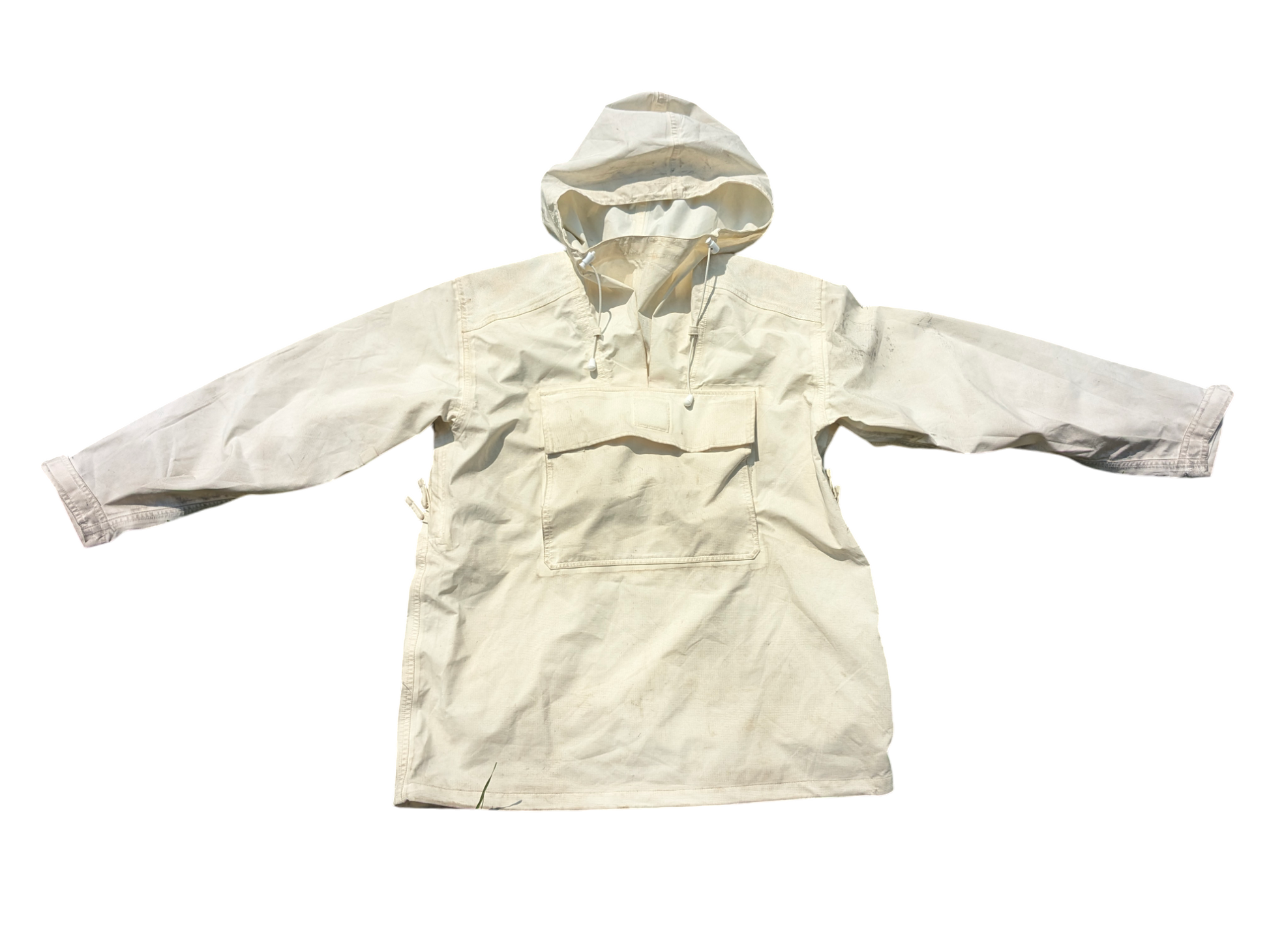 The Six Gun Surplus French Army Alpine Snow Camo Parka is a white, long-sleeve pullover featuring a hood and a spacious front pocket. Crafted from lightweight material, it includes drawstrings at the hood and offers a loose fit that extends to mid-thigh length. The wide sleeves highlight its relaxed design, making it ideal for winter conditions.