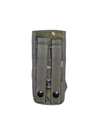 A camouflage-patterned Six Gun Surplus British MTP Smoke Grenade Pouch made of durable fabric against a black background. The pouch, compatible with MOLLE systems, has two vertical straps with metal snaps for attachment, and stitching is visible along the edges and seams.